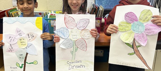 Three students showing their work