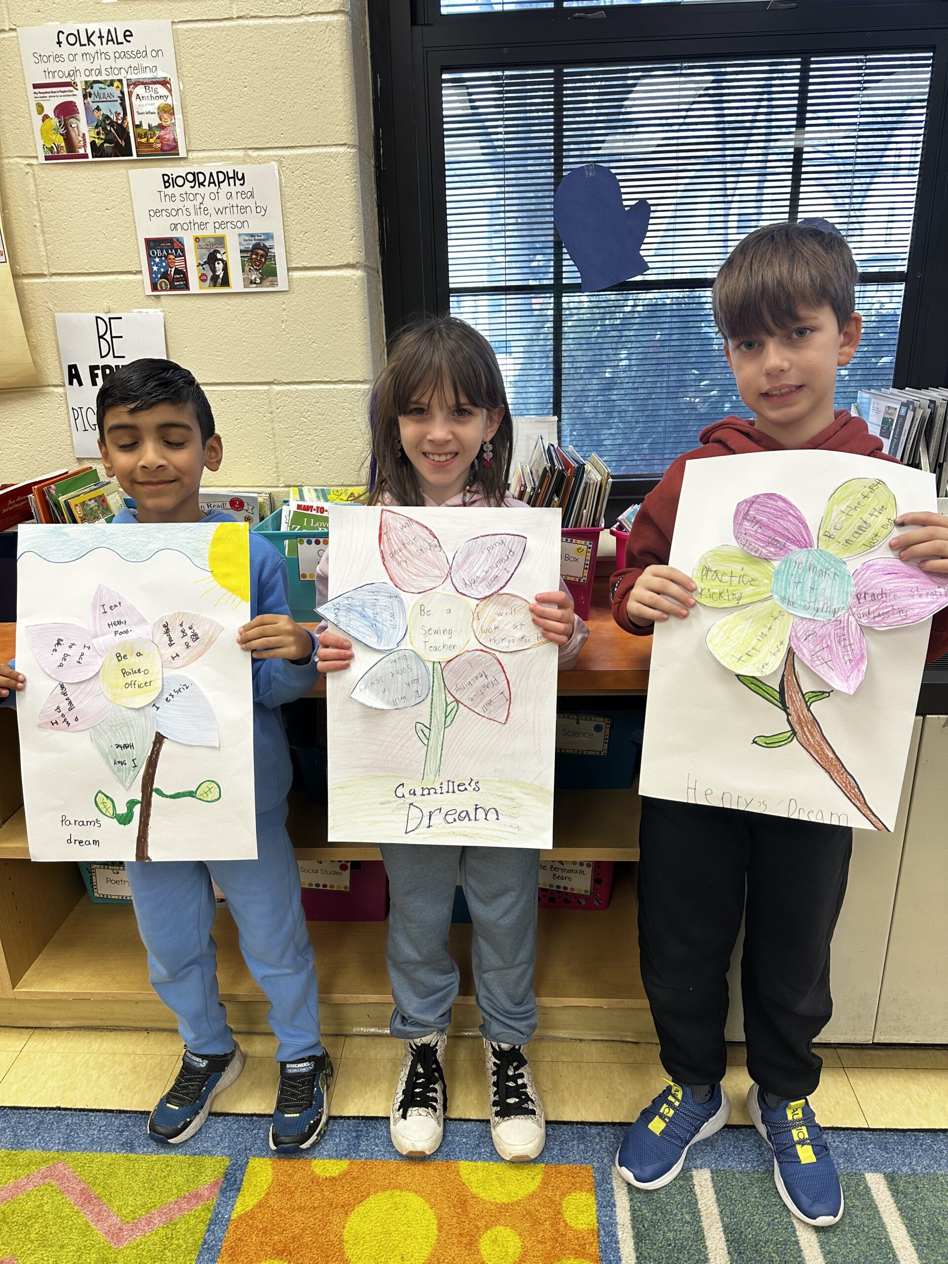 Three students showing their work