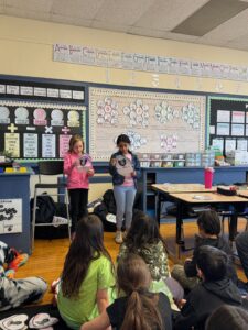 Two students presenting research