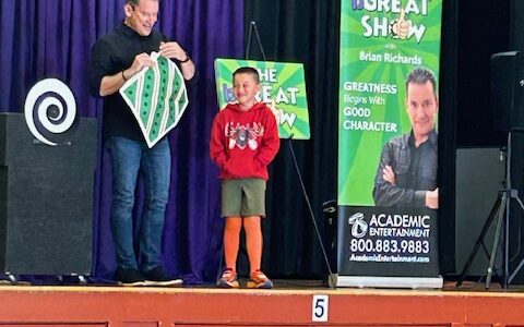 Student participating in assembly