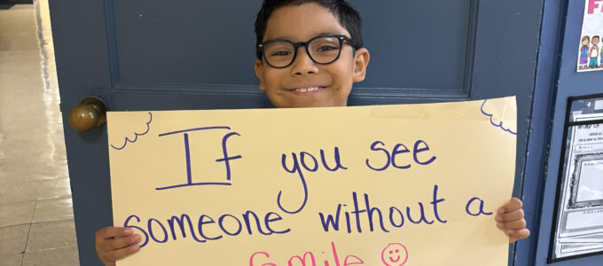 Student holding up quote